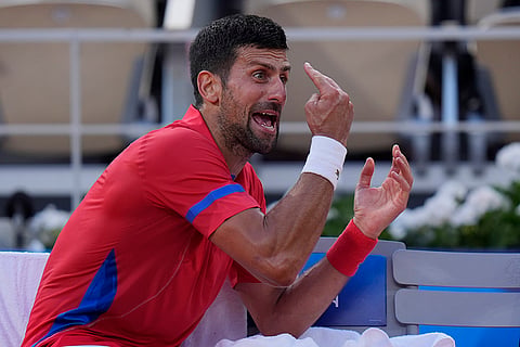 Novak Djokovic of Serbia reacts during a break in men's singles semifinals tennis match